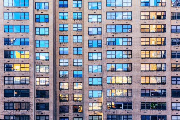 istock Modern building with reflections on the glassy windows 1421226586