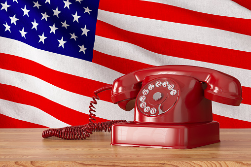 USA Diplomacy Concept Retro Phone with American Flag. 3D Render