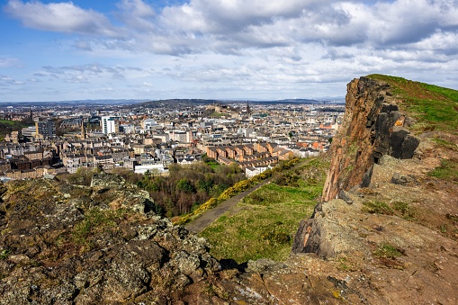 A view from Arthur's Seat to the Salisbury Crags with Edinburgh in the background.