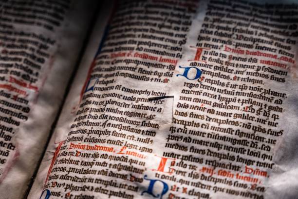 istock Closeup of ancient text pages with calligraphy. 1421228973