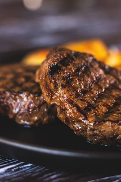 istock Appetizing steak with potatoes close-up 1421229668