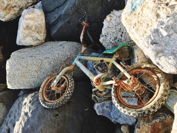 istock rusty bicycle - bike on the rocks 1421229675
