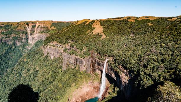 istock Beautiful waterfall surrounded by cliffs with green vegetation. Barehipani Falls, India. 1421230811