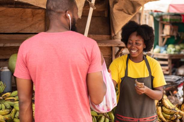 istock woman selling in a market 1421231378
