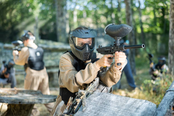 istock Paintball player recklessly aims with a gun on battlefield 1421232721