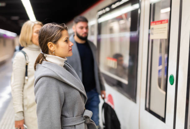 istock Female waiting for train on subway platform 1421233850