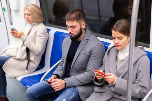 istock People browsing in smartphone in subway 1421233891