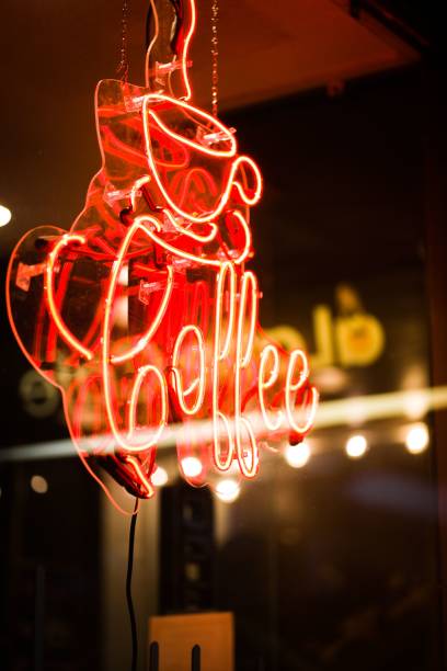 istock Cafe's neon glowing sign with coffee lettering 1421234088