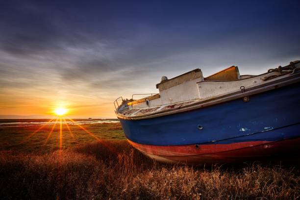 istock Abandoned boat during sunset on Heswall marsh coast, in the Wirral 1421235187