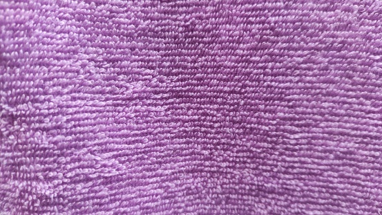 Abstract background of the soft fabric details of pink towel