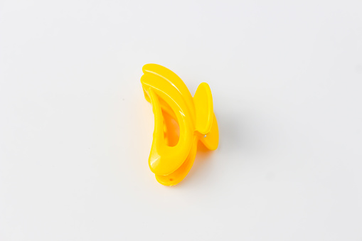 Yellow-colored Jaws Hair Clip Isolated on a White Background