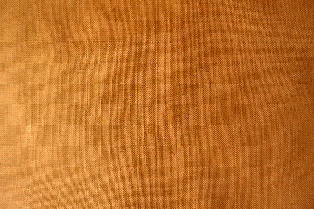 istock Backdrop - brownish orange hemp and cotton fabric 1421240352