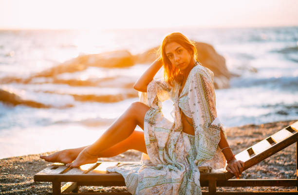 Beautiful Woman on the Beach at Sunset