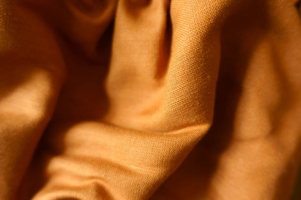 istock Folded brownish orange hemp and cotton fabric 1421240827