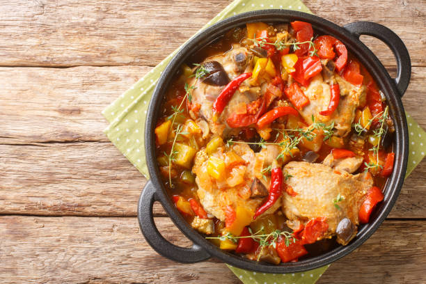 istock Kedjenou Chicken and Vegetable Stew Without Using Water closeup in the pan. Horizontal top view 1421240893