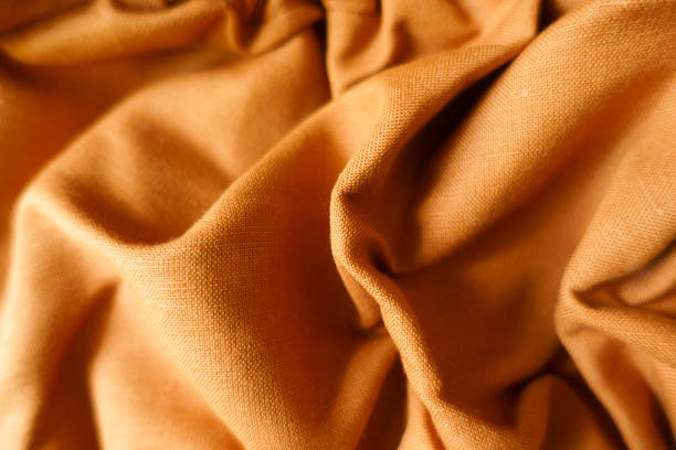 istock Rippled brownish orange hemp and cotton fabric 1421241080