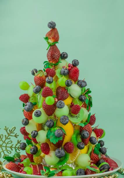 istock Fresh mixed fruits christmas tree shape 1421242168