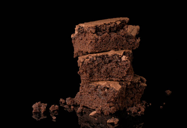 istock Gourmet brownies on black background 1421246815