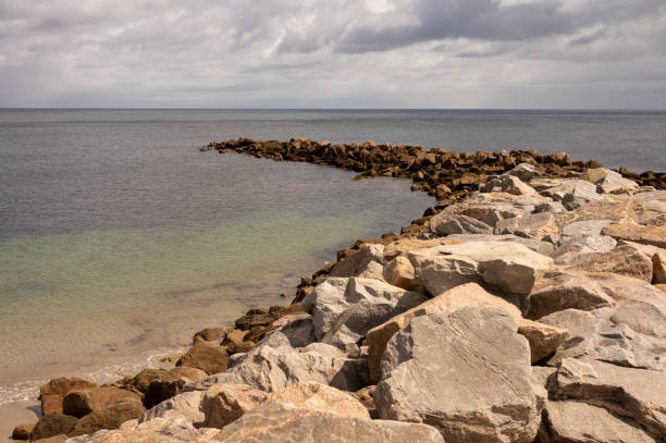 istock A rocky jetty jutting out into the sea 1421247505