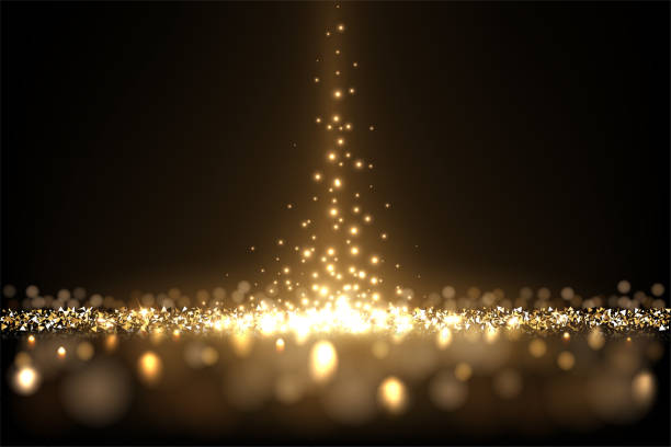 istock Gold glitter and sparkle of falling confetti in spotlight light beam, burst of particles 1421248342