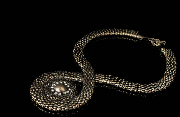 istock Romantic beautiful pendant on black background 1421250154