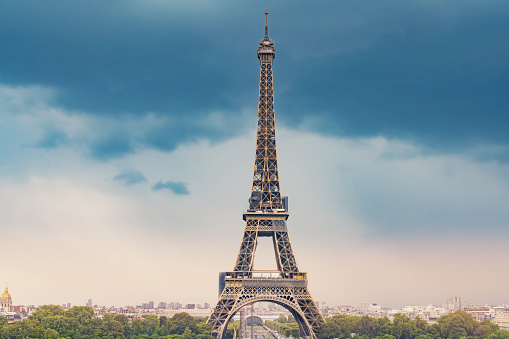 Eiffel tower in front of dramatical sky