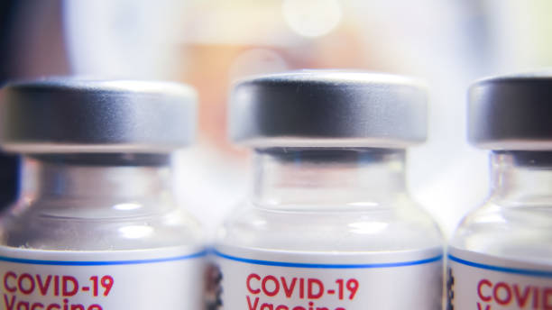 Thailand – SEPTEMBER  5. 2022: Closeup of biontech pfizer and moderna spikevax mrna covid-19 vaccination and vaccine vials epidemic. stock photo