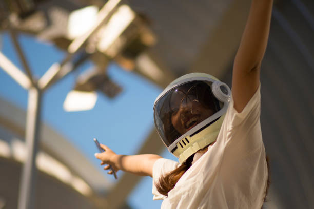 Team of astronauts in starship travelling to Mars conducting safety checks using tablet. Teamworking cosmonauts flying to red planet operating spacecraft control interface, calibrating sensors