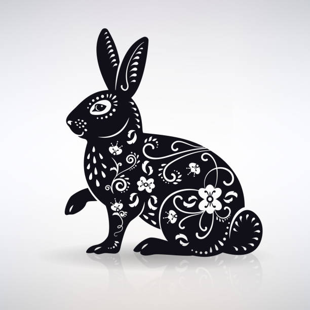 The Symbol of the Year a Black Rabbit The symbol of the year a black rabbit on a light background fluffy rabbit stock illustrations