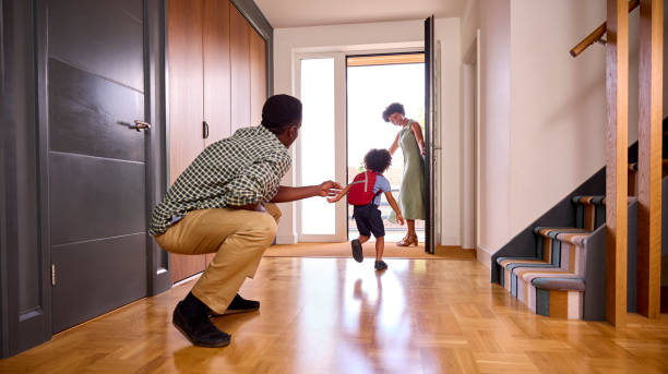 istock Parents At Home Helping Son Getting Ready To Go To School 1421263308