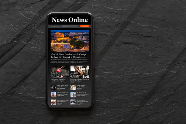 Mobile phone with sample news website on the screen