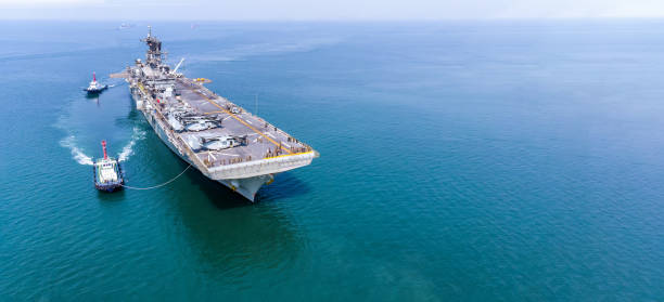 nuclear ship, military navy ship carrier full loading fighter jet aircraft and helicopter for patrol. - tug o war imagens e fotografias de stock