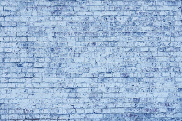 istock Brick wall with unusual blue bricks made of whole blue bricks and broken blue bricks 1421266248