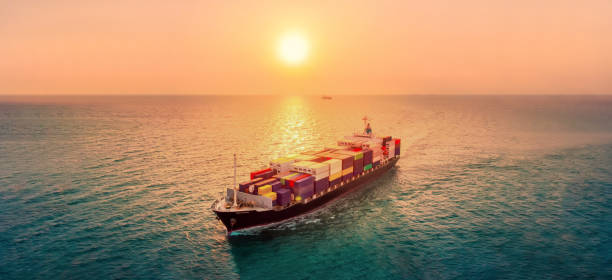 istock Smart cargo container  ship at sunset import export container concept freight shipping sea port. 1421267118