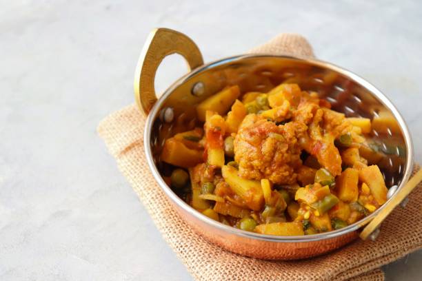 istock Aloo Gobi Mutter curry, cauliflower, and peas curry. Aloo Gobi masala. Served with wheat roti. famous Indian curry dish with potatoes and green peas. Copy space 1421269428