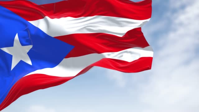 Flag of Puerto Rico waving in the wind on a clear day