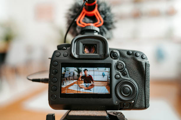 istock Young Man Filming A Vlog On Exercising At Home 1421271630