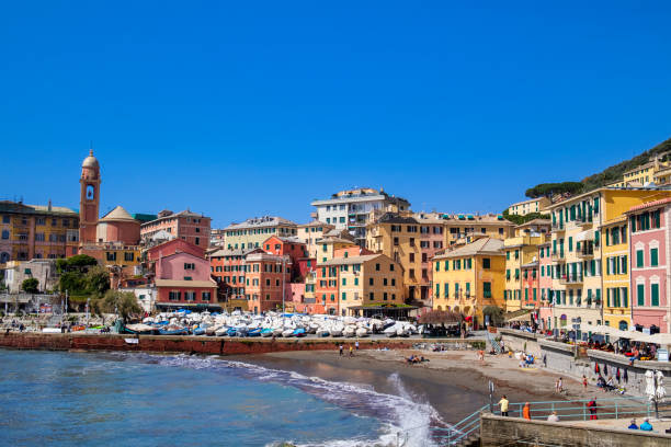 People enjoy a sunny spring day at the beach of Nervi, a seaside resort and a quarter of Genoa
