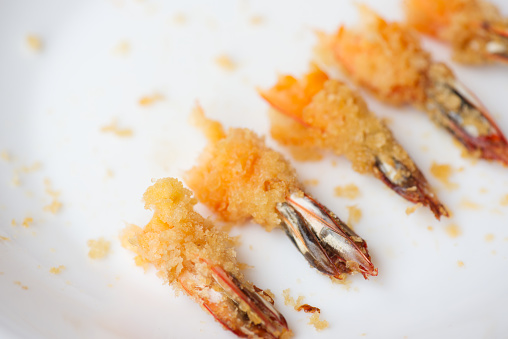 Tails of fried shrimp.