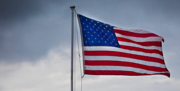 istock Storm behind an American flag 1421278848