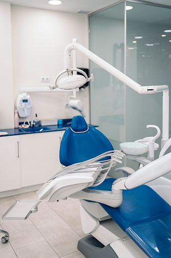 Dental chair and other equipment in modern dental clinic.