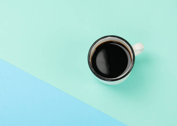 istock Cup of coffee on color background. 1421280762