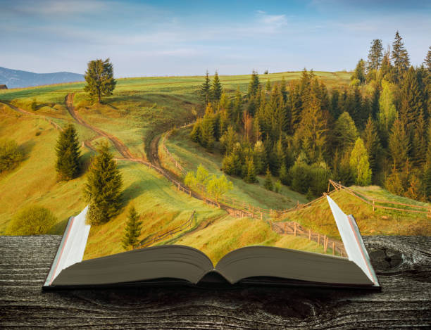 istock Spring mountain valley on the pages of book 1421282892