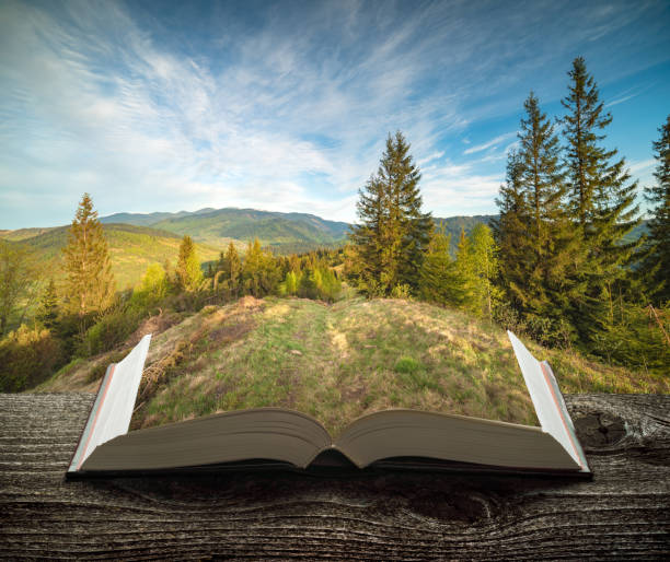 istock Mountain valley on the pages of book 1421282973