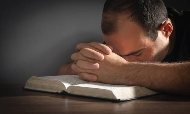 istock Caucasian man with a Holy Bible. Religion. Education 1421283242