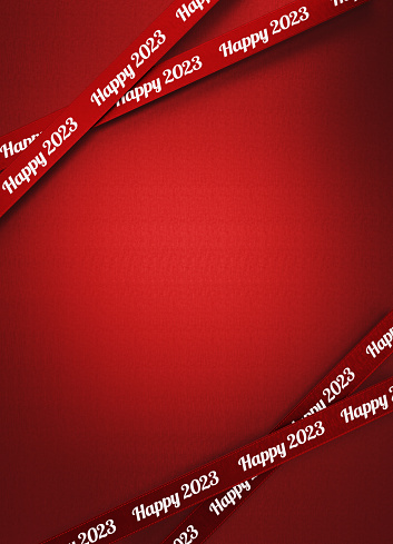 Happy 2023 written red ribbons Over red background. Vertical composition with copy space. 2023 concept.