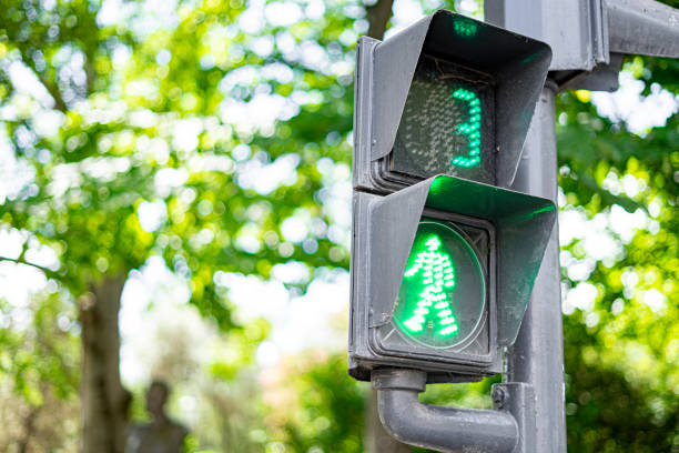 istock green traffic light to control pedestrian crossing with a countdown to 3 second. 1421286343
