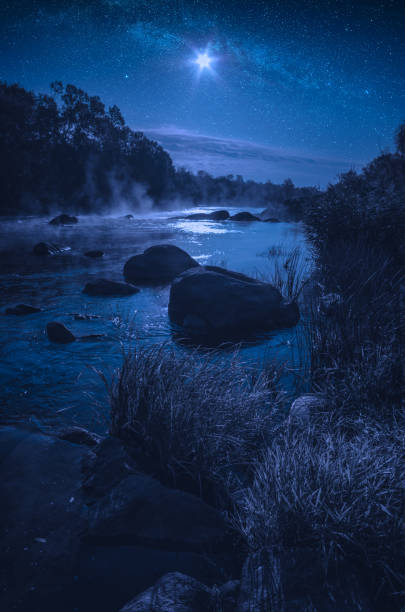 Rocky river in a light of rising moon. Southern Bug river, Ukraine.