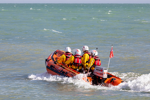 Eastbourne, UK - Aug 19, 2022:Royal National Lifeboat Institution (RNLI)  team at the Eastbourne airshow 2022.