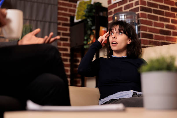 istock Caucasian patient talking to professional counselor at therapy 1421294159